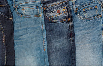 Multiple pairs of blue jeans.