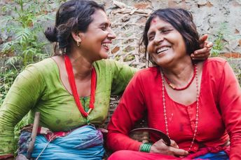 Happy Nepali women in traditional attire.