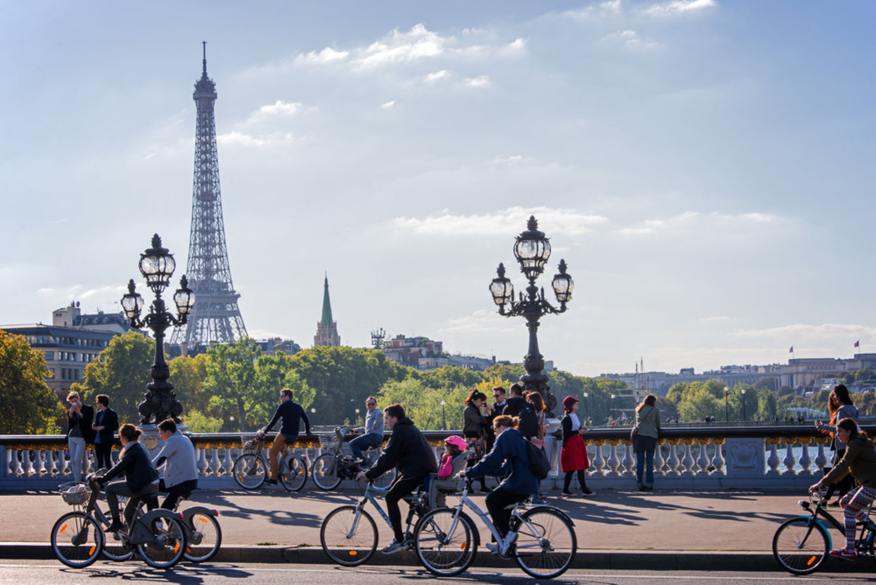 People on bicycles and pedestrians enjoying a car-free day on Alexandre III bridge on September 27, 2015 in Paris, France