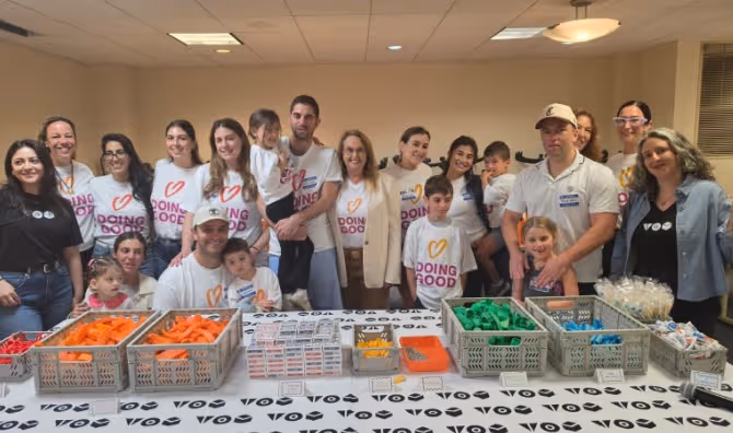 Shari Arison stands with Good Deeds Day volunteers.