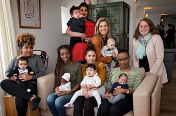 Queen Máxima of the Netherlands sits with young mothers at the Baby House in Dordrecht