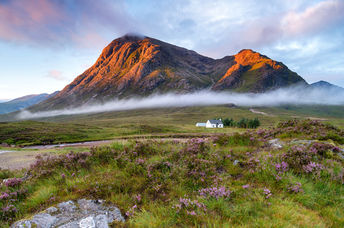 Sunrise over the mountain tops at Glencoe in the highlands of Scotland