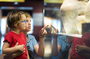 Mother and daughter at a history museum.