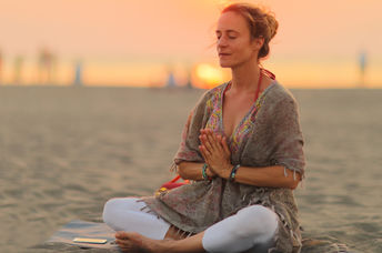 Practicing Kundalini yoga.