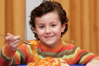 This boy is eating a healthy and nutritious kid-friendly meal.