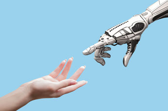 Human and robot hands symbolizing the link between people and AI