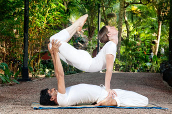 Reap the health benefits of yoga for two.