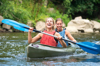 Kayaking on a river.