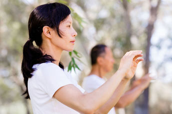 Woman practicing tai chi.