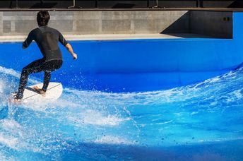 Surfing in an urban wave pool.