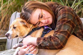 A woman with her therapy dog.