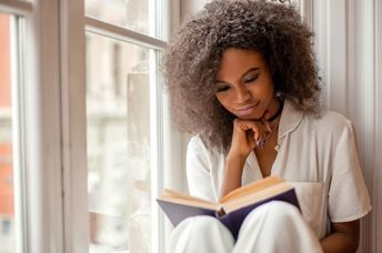 a woman engrossed in a good book.