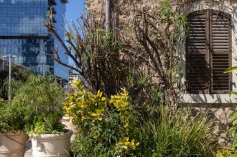 Historic buildings and modern skyscrapers in Tel Aviv’s restored Sarona quarter.