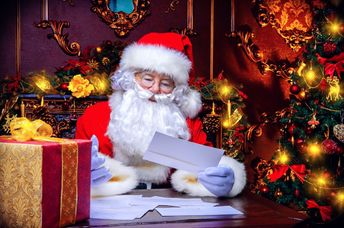 Santa reading a letter.