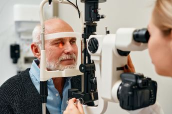 A senior getting an eye exam.