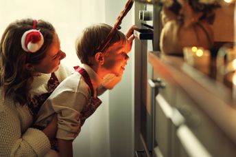 Mother and son cooking a festive meal.