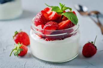 Greek yogurt with strawberries is a healthy breakfast.