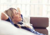 A woman relaxing on the couch.