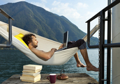 Man on hammock with laptop