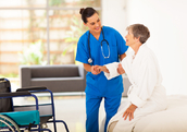 A nurse helps a patient