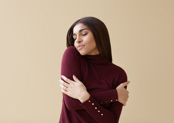 A woman hugging herself