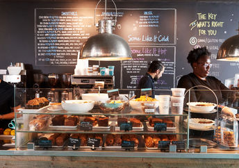 Freshly cooked dishes are presented at one of the locations of the Instock restaurant.