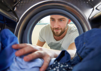 man doing laundry.