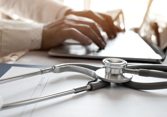 A stethoscope on a laptop