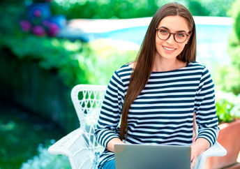 Happy woman using her computer.