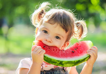 Girl eating watermelon.