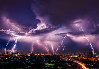 A lightning strike over a city.