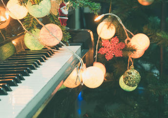 Piano decorated for Christmas.