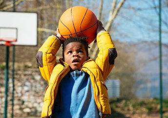 Kid with a basketball.