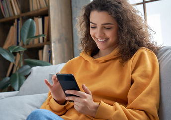 Young woman using her smartphone.