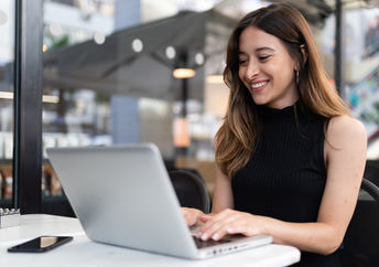 A young woman typing.