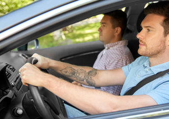 Two people in a car.