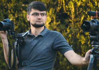 A videographer with two cameras.