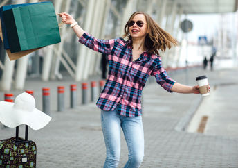 A woman dancing at the airport.