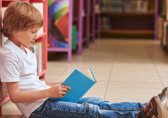 Cute boy with a book.