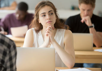 Young woman thinking of creative ideas.