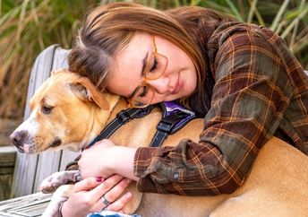 A woman with her therapy dog.