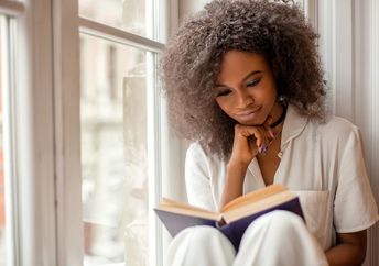 a woman engrossed in a good book.