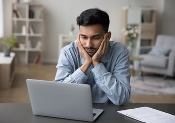 A man who is stuck in a procrastination cycle.