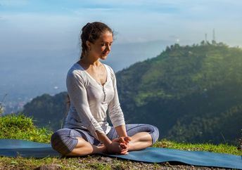 Practicing yoga in a spiritual setting.