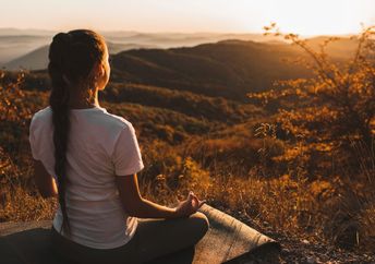 Woman meditating in nature.