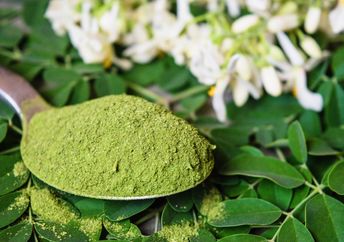 Moringa powder, leaves and flowers.