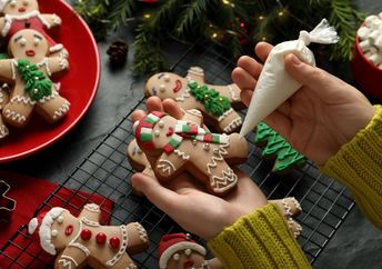 Decorating gingerbread men.