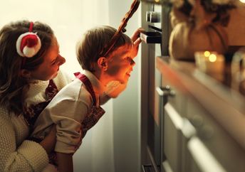 Mother and son cooking a festive meal.