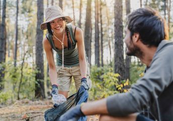 Volunteers cleaning a public hiking trail.