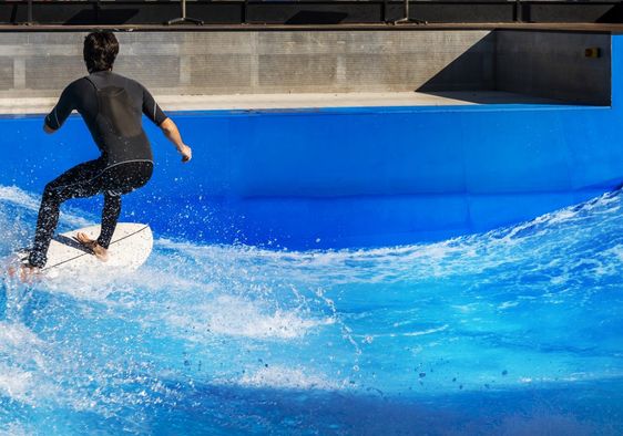 Surfing in an urban wave pool.